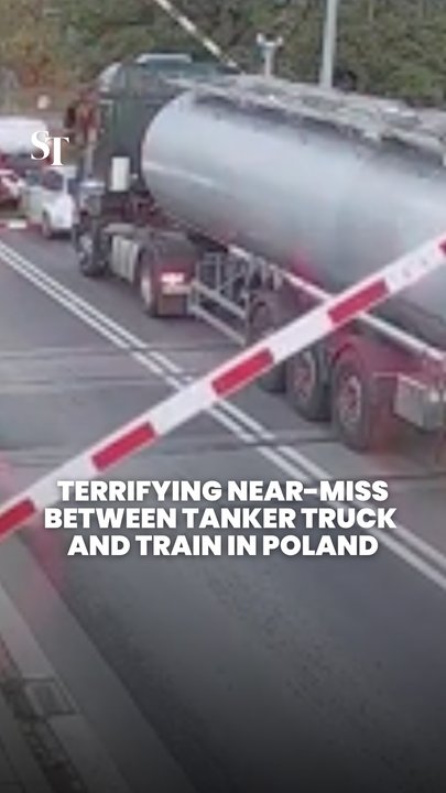Tanker truck narrowly avoids collision with train in Poland