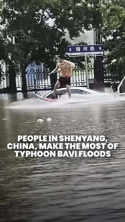 Shenyang residents seen waterskiing, swimming in Typhoon Bavi floodwaters