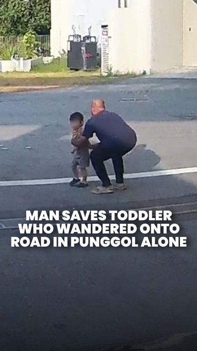 Man alights from vehicle to pick up unaccompanied child running across road in Punggol