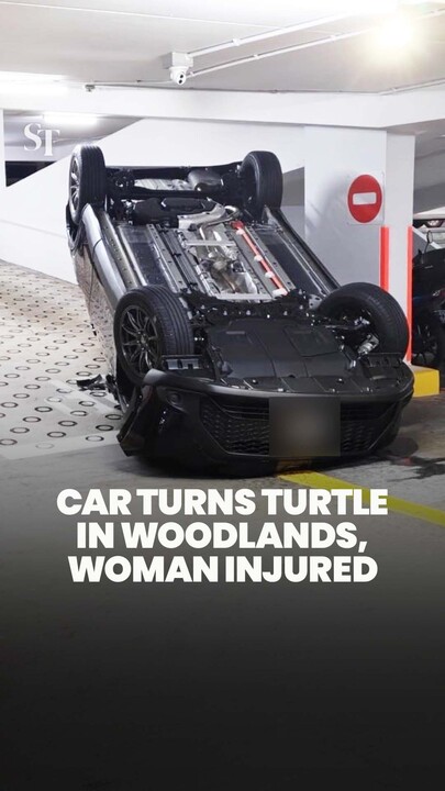 Woman injured after car turns turtle at Woodlands carpark
