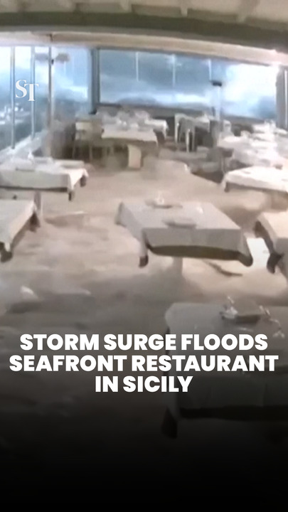 Storm surge swamps seafront restaurant in Sicily, Italy