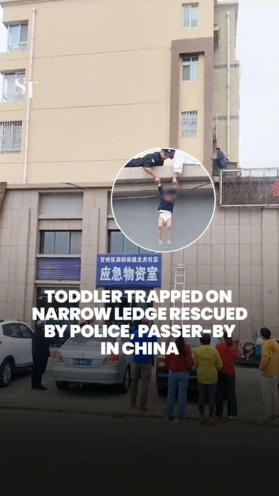 Toddler in Gansu province, China rescued after being trapped on a narrow window ledge 