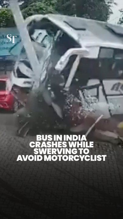 Terrifying moment bus crashes into petrol station after swerving to avoid motorcycle collision in Kerala, India