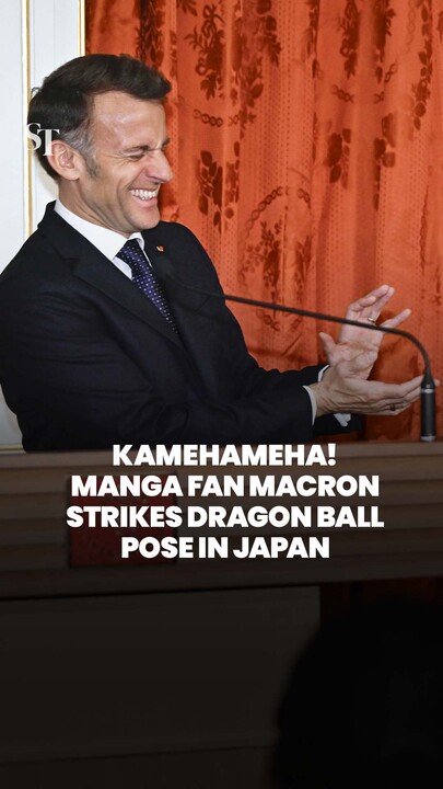 Manga fan Macron strikes Dragon Ball pose in Japan