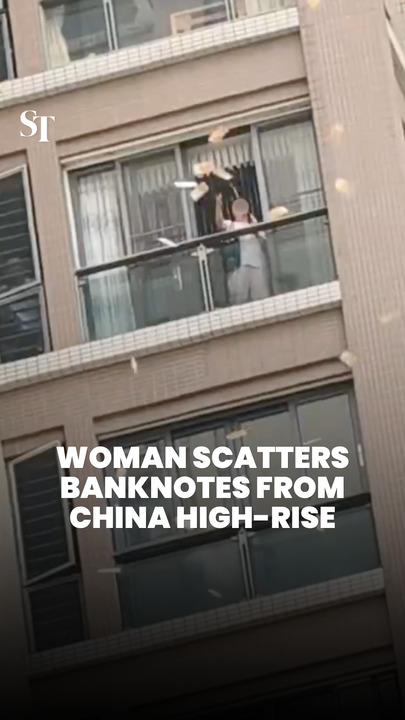 Woman scatters huge amounts of banknotes from Guangdong high-rise apartment