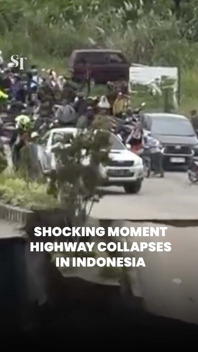 Massive sinkhole opens up as a section of a highway in Indonesia collapsed