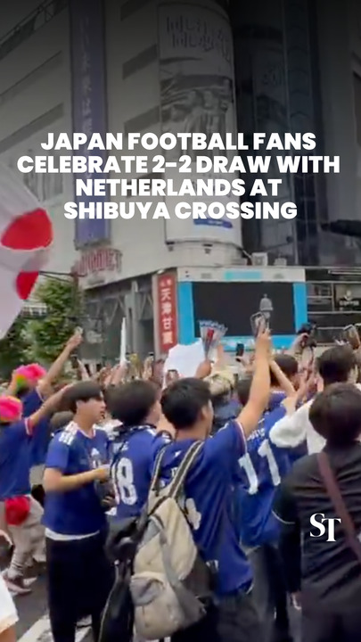 Japan football fans celebrate 2-2 draw with Netherlands at Shibuya crossing