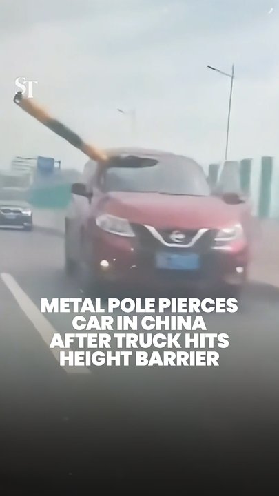 Driver in China cheats death as metal pole pierces through his car