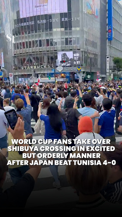 World Cup fans take over Shibuya crossing in excited but orderly manner after Japan beat Tunisia 4-0