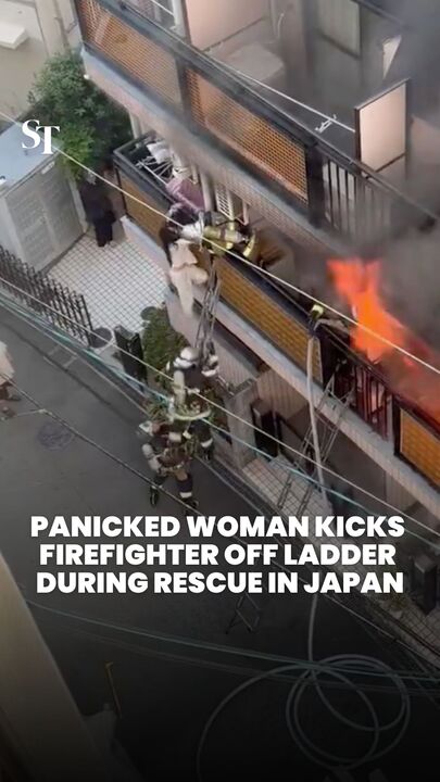 Panicked woman kicks firefighter off ladder during rescue in Japan 