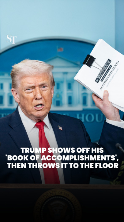 Trump touts a stack of his first-year accomplishments… then throws it on the floor