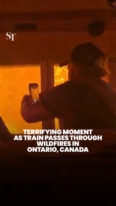 Terrifying moment as train passes through forest fires in Ontario