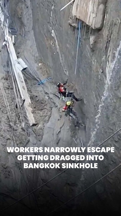 Workers narrowly escape getting dragged into Bangkok sinkhole