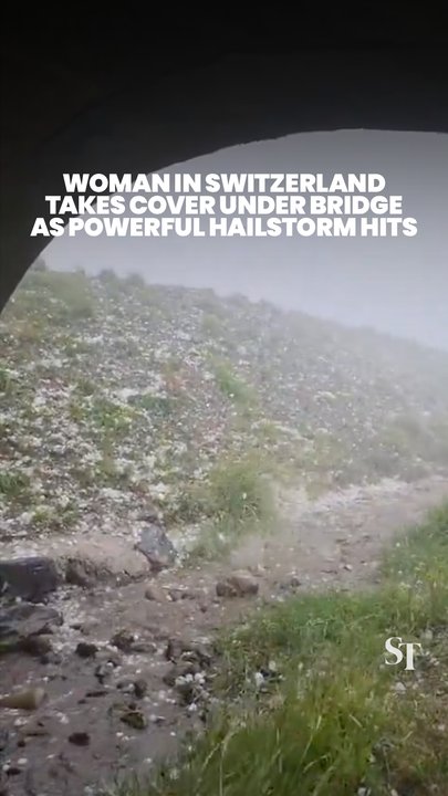 Woman in Switzerland takes shelter under bridge just as powerful hailstorm hits