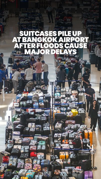 Thousands of suitcases pile up at Bangkok’s Suvarnabhumi Airport amid flood delays