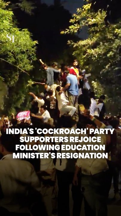 Supporters of India’s Cockroach Janta Party celebrate education minister’s resignation