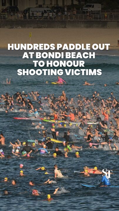 Hundreds paddle out at Bondi Beach to honour shooting victims