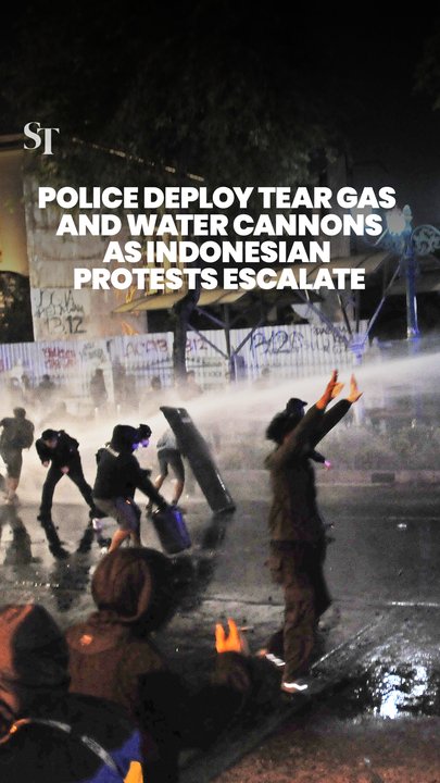 Police clash with protestors in Indonesia, deploying water cannons and tear gas as tensions flare