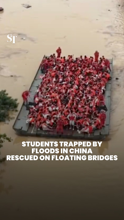 Rescuers use floating bridges to evacuate students from Guangxi floods